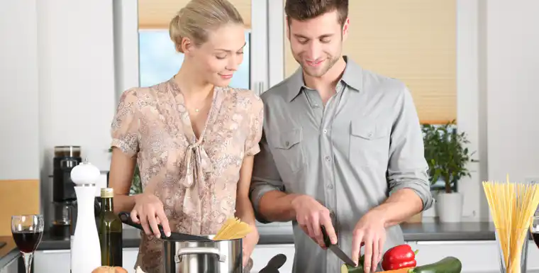 woman and man cooking in the kitchen